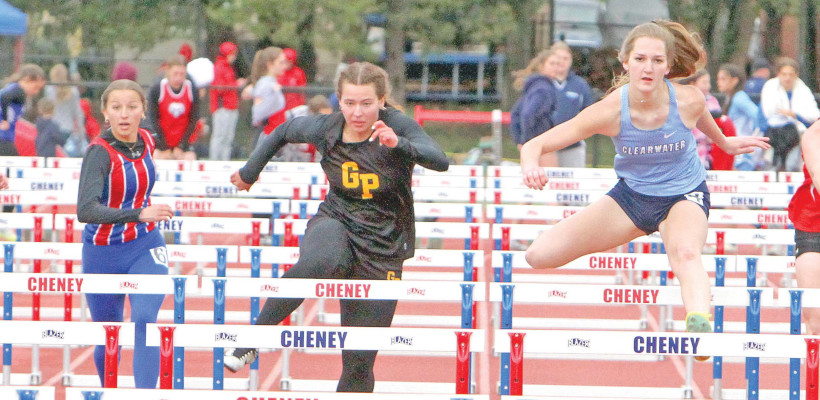 Cheney’s Raegen Black, left, Garden Plain’s Celia Puetz and Clearwater’s Kenzy McArtor battle each other during a preliminary race in the 100-meter hurdles at last Friday’s Vernon Ferguson Invitational track meet, hosted by the Cheney Cardinals. Cheney, Clearwater and Garden Plain finished as the top three girls teams, while Garden Plain won the boys competition. By Travis Mounts/TSnews