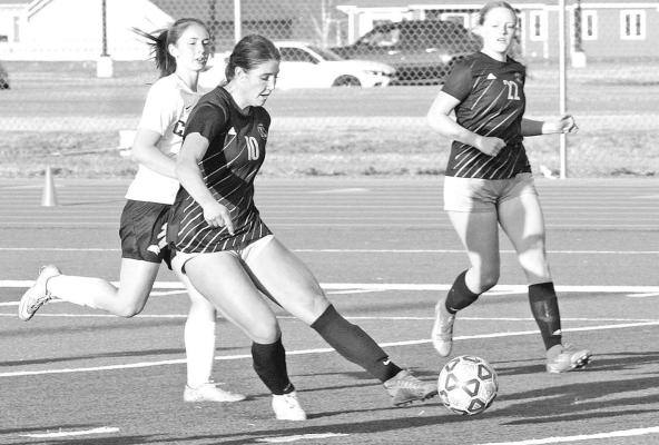 Bella Smith fires off a goal during Eisenhower’s victory over the visiting Campus Colts. Smith, a junior, scored the final goal in the Tigers’ 3-0 win last Thursday. Travis Mounts/TSnews