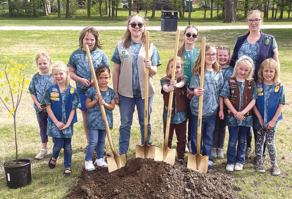 Members of Girl Scout Troop 40266 in Goddard celebrated Earth Day with a tree planting and marked the upcoming Neighbors United with a ribbon cutting. The Scouts had a ceremonial turning of the dirt as well. Travis Mounts/TSnews