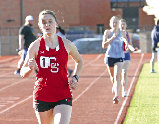 Conway Springs’ Cheyanne Tull opens up a big lead on Clearwater’s Megan Stevens and Cheney’s Riley Grusing in the 1600 meters last Friday in Clearwater. See more meet photos online at www.tsnews.com. Travis Mounts/TSnews