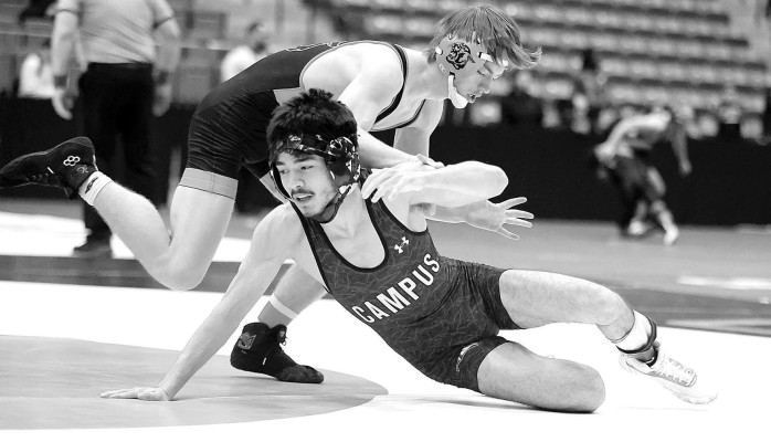Julio Sanchez of the Campus Colts escapes from an opponent during firstday action at the Class 6A State wrestling meet in Park City. Stephanie McKennon/ TSnews