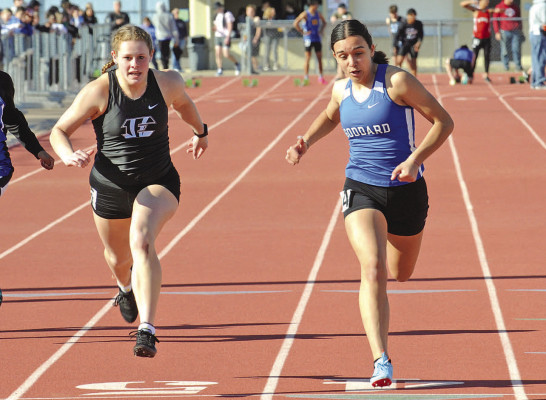 Mackenzie Popp of Eisenhower and Leah LaPlant of Goddard battle in the 100 meters last week. LaPlant took first, and Popp finished second. See more track meet photographs online at www.tsnews.com. Dale Stelz/TSnews