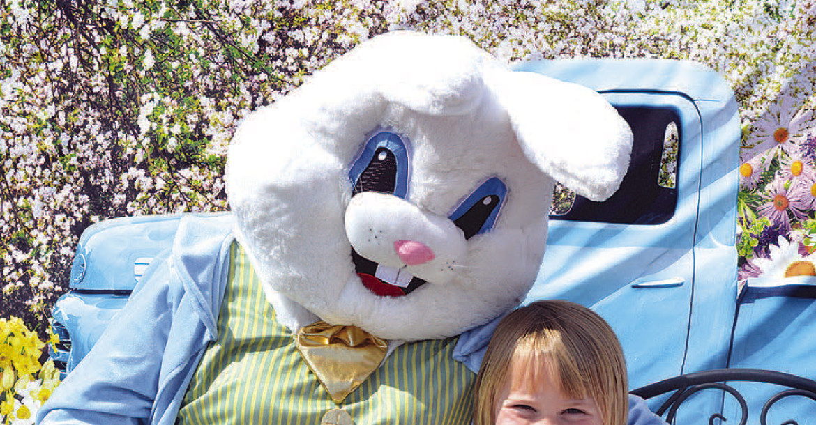 Elizabeth Etheridge snuggles up to the Easter bunny during Saturday’s egg hunt in Goddard. See more photos on Page B1. Dale Stelz/TSnews