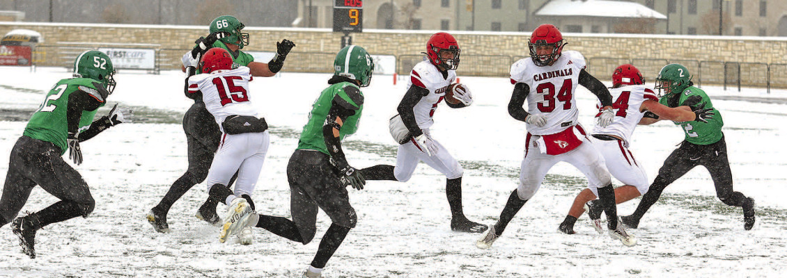 Brayden Kunz gets a lot of blocking help on a big run during Conway Springs’ State championship victory over Jefferson County North. Kunz scored three touchdowns, and the Cardinals won the eighth State title in their history. Stephanie McKennon/TSnews