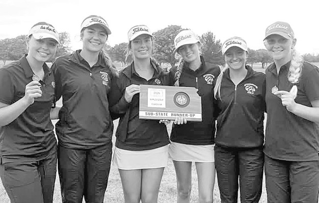 The Eisenhower Tigers golf team, above, placed second at its 5A regional tournament. The Goddard Lions, pictured below, finished right behind in third place. Contributed photos