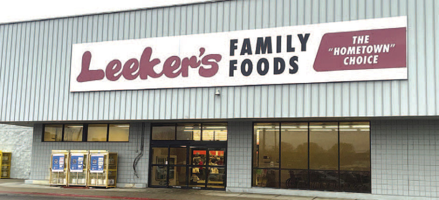 A sign change advertises the new ownership of Haysville’s grocery store. Leeker’s Family Foods reopened the store on Saturday. Travis Mounts/TSnews