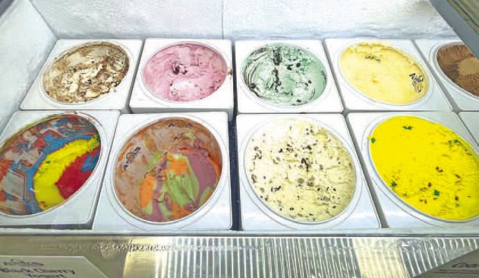 ABOVE: The Kennard family – from left, Melainy, Daphne, Bailey and Wade – have opened The Daily Scoop, located in downtown Conway Springs. It offers ice cream, pies and cheesecakes, muffins and coffee, as well as a place for local residents to gather. LEFT: Bob and C.J. Kennard, Wade Kennard’s father and stepmother, are The Daily Scoop’s resident bakers. BELOW: Popular ice cream flavors include Play Dough, which is the bright yellow ice cream. Travis Mounts/TSnews
