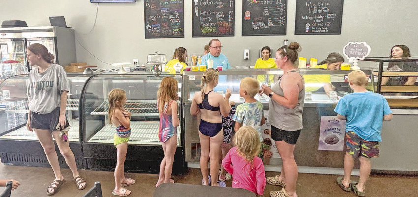 A late rush on Friday afternoon keeps the staff at The Daily Scoop busy. The new ice cream shop opened last week on Monday in downtown Conway Springs. Travis Mounts/TSnews