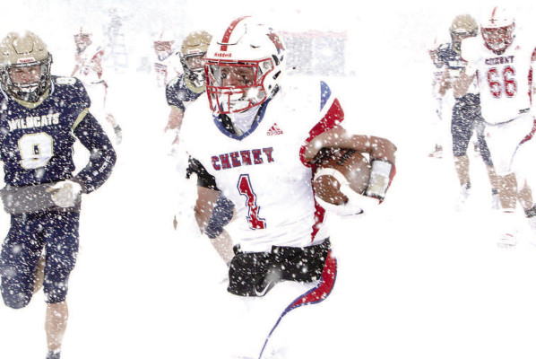 ABOVE: Jackson Voth breaks free for a long run early in Saturday’s game. He reached the Hayden 5-yard line, setting up teammate Drew Tolar for the game’s first score. BELOW: Quarterback Josh Burdick, left, looks for an open receiver. He led the Cardinals to a perfect 13-0 season and Cheney’s first-ever State title. Travis Mounts/TSnews