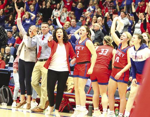 Cheney head coach Sarah McCormick and the rest of the Cardinals’ bench celebrate a basket during the second half of their comeback victory over undefeated Phillipsburg at last Friday’s Class 3A State semifinal. Travis Mounts/TSnews