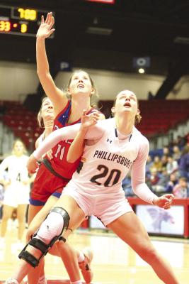 Campbell Hague of Cheney battles Heather Schemper for rebounding position.