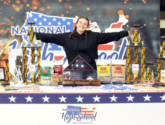 Campus High student Cerina Brandt shows off the trophies and prizes at Saturday’s state high school barbecue competition. Brandt did much of the work to put the competition together. Contributed photo