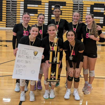 The Goddard Lions celebrate their volleyball tournament victory last week at Wichita Southeast High School. Contributed photo