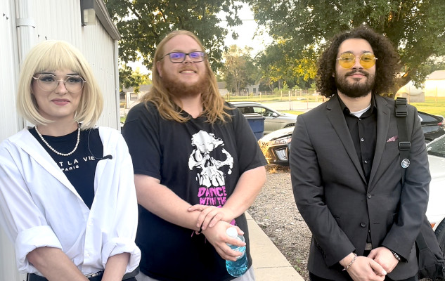 Travis Mounts/TSnews Hunter Gromala, left, visits with media following Wednesday's meeting of the Sedgwick County Fair Association. Also pictured are band members Nick Ramsey, center, and Ryan O'Neal.