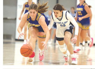 FAR LEFT: The Indians’ Callie Noland battles a Collegiate player for a loose ball during Friday’s game in Clearwater. LEFT: Clearwater’s Collin Streit puts up a shot against Collegiate. For sports coverage, turn to Sports, starting on Page B2. Subscribers can see additional photos online at tsnews.com. Stephanie McKennon/TSnews