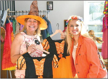 Designers Janice Meinhardt and Marie Taylor show off some of their Halloween-themed dresses. Dale Stelz/TSnews