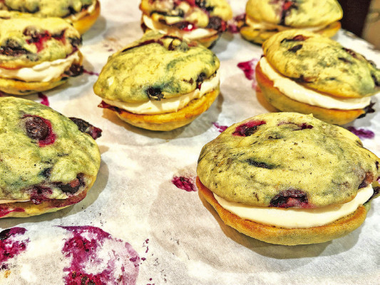 Lemon blueberry whoopie pies feature fresh or frozen blueberries, along with plenty of lemon zest, to compliment a cream cheese-based filling that creates the perfect summer dessert.