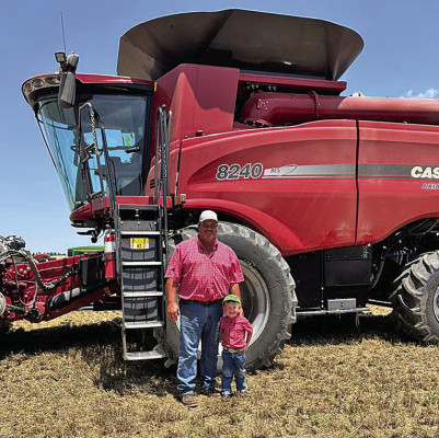 Ryan Chitwood and grandson Logan Hines pose together after wrapping up harvest recently in Sumner County. Contributed photo