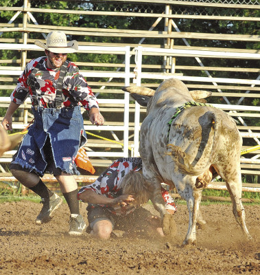A rodeo clown gets roughed up during Saturday’s Bull Jam, put on by the Cheney Saddle Club. The event, now in its second year, also included a post-rodeo concert. Subscribers can see more photos online at tsnews.com. Dale Stelz/TSnews