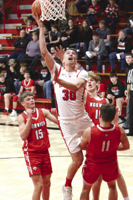 Filippo Leonardi drives to the basket in Argonia’s home game against Norwich last Friday. He made the shot but was called for an offensive foul Leonardi led the Raiders with 13 points. Travis Mounts/TSnews