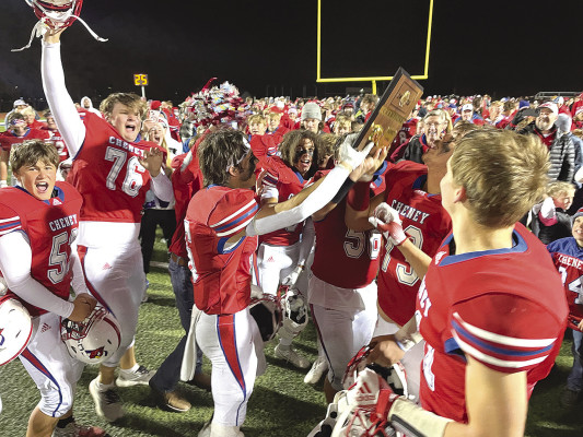 The Cheney Cardinals celebrate their regular-season victory over the Andale Indians. The game made headlines across the country, as Cheney ended Andale’s nation-leading 57-game winning streak. Cheney also won a rematch with Andale to earn a spot in the Class 3A State championship football game. Travis Mounts/TSnews
