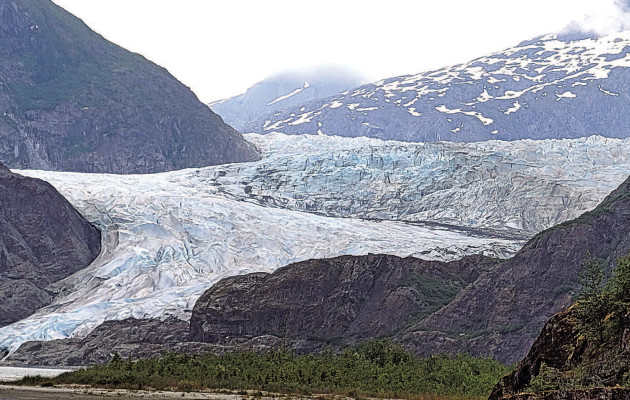 The Mendenhall Glacier looms large in the background, as fog moves into the mountainous area around it. Paul Rhodes/TSnews