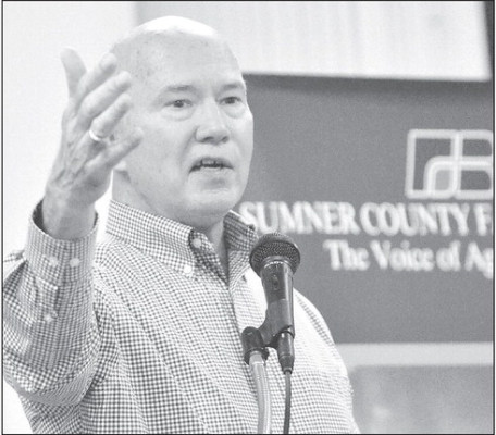 Chris Frank, who is senior producer for KPTS-TV Channel 8 in Wichita, addresses the crowd on hand for the recent annual meeting of the Sumner County Farm Bureau Association. Paul Rhodes/TSnews