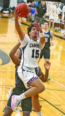 The Colts’ Pedro Tavares drives to the basket during the first half of last week’s game against the Tigers. Eisenhower won on the road, thanks to a second-half comeback. Stephanie McKennon/TSnews