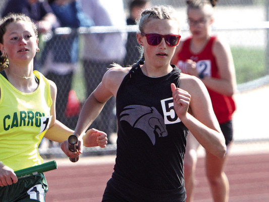 Jada Arneson moves into the lead on the final leg of the 4x800-meter relay. Her efforts helped the Campus Colts win the event at their home track and field meet at Colt Stadium last Friday. Travis Mounts/TSnews