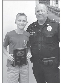 12-year-old Luke Brin accepted a plaque for his essay at the Cheney City Council meeting. Contributed photo