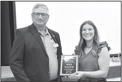 Mick Rausch of Garden Plain receives a plaque from Aston Schneider. He was the longest-serving of four people to step down from the Sedgwick County Farm Bureau Association Board. The others were Emily Kerschen, Meghan Mueseler, and Jay Pauly. Dale Stelz/TSnews