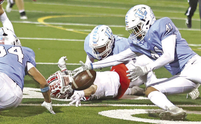Eisenhower Tiger Isaiah Martin (41) recovers a Maize fumble during the Tigers’ come-from-behind victory over the Eagles. The Tigers’ record-setting season continues this Friday against Kapaun-Mt. Carmel in Wichita with a spot in the Class 5A State championship on the line. Stephanie McKennon/TSnews