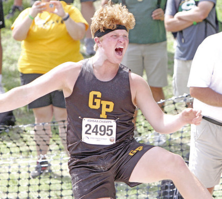 Travis Mounts/TSnews LEFT: Luke Hillman lets out a yell after one of his throws in the finals of the Class 2A State shot put competition. He placed first in the event. 