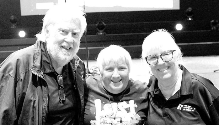 Karla Wulf, center, is pictured with Tim and Susan Norton. Wulfe received the first Tim and Susan Norton Distinguished Service Award. Contributed photo