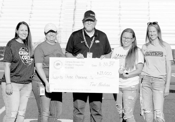 The Campus Athletic Booster Club presented a $23,000 donation to Haysville Public Schools during last week’s scrimmage event. Accepting on behalf of the athletics programs was Campus High School athletic director Ron Allan. Contributed photo