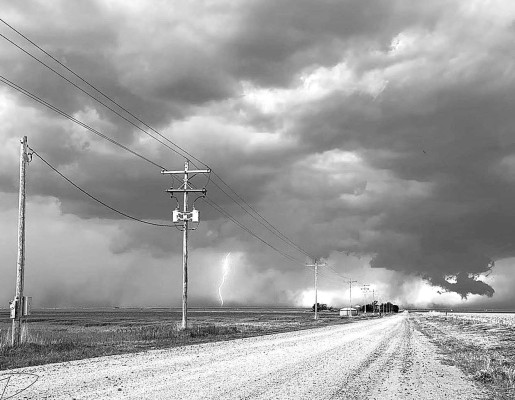 A severe storm releases a bolt of lightning on May 19 over Finney County. Kansas saw more than double the number of tornadoes in 2024 than the previous year, with a preliminary report of 89. A.J. Dome/Kansas Reflector