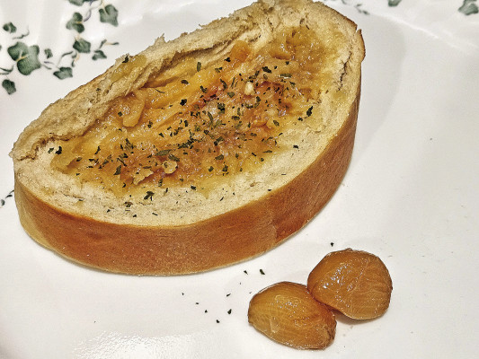 Garlic confit is made by slowly roasting whole cloves of fresh garlic in olive oil to create a nutty, spreadable garlic with a delicious, concentrated flavor.