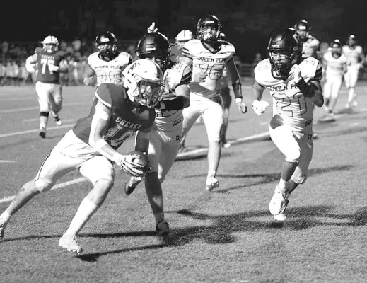 Cheney’s Brayden Dibble (10) closes in on the end zone as Garden Plain defender Braylen Dold (21) closes in to stop the play. Cheney topped Garden Plain on homecoming night. Andrea McDaniel/TSnews