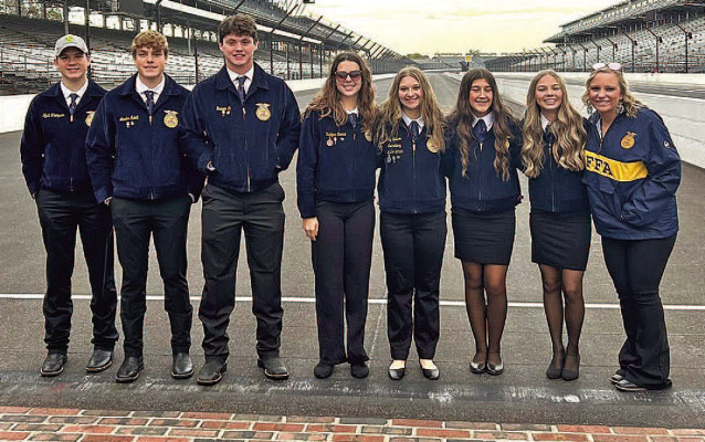 Members of the Clearwater High School FFA stand at the start-finish line at the Indianapolis Motor Speedway. The students recently visited Indianopolis for the national FFA convention. Contributed photo