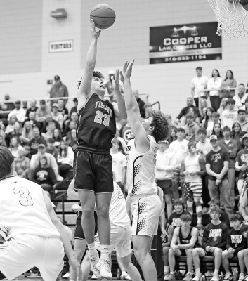 Derek Morgan puts up a shot over a defender during Eisenhower’s game against Andover Central in Saturday Class 5A substate championship. Matt Bucher/Ginger Viking Fotos
