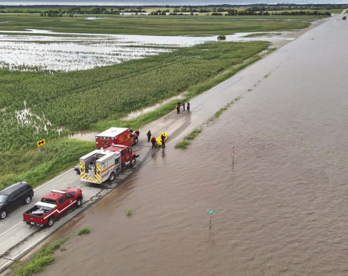 Sumner County rescue personnel responded Saturday to two vehicles that were swept off the road in the 600 block of South Oliver, southeast of Wellington. One driver died. Contributed photo