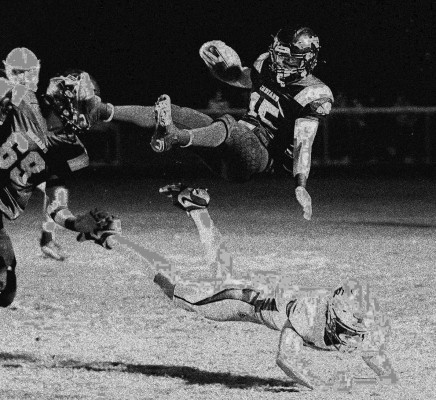 Cheney defensive back Reece Tolar upends Andale quarterback Sam Harp in last week’s playoff loss. Travis Mounts/ TSnews