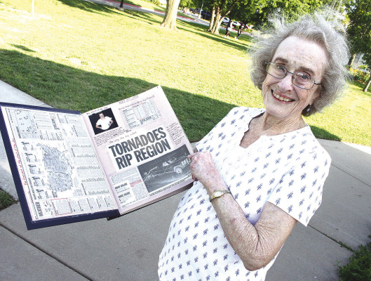 Della Shafer of Haysville shows off her scrapbook that documents the destruction and recovery from the May 3, 1999, Haysville tornado. She shares her birthday with that fateful event. Travis Mounts/TSnews