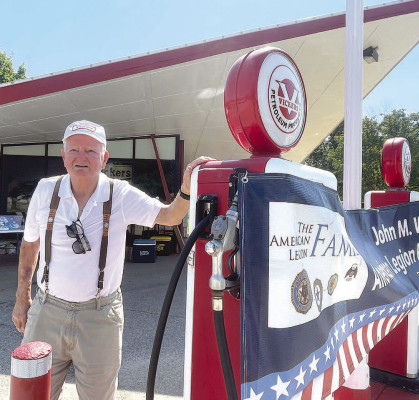 Don Davidson stands next to a gas pump at the historic Vickers service station in Haysville. Davidson worked there in the late 1950s and early 1960s, starting when he was still in high school. Travis Mounts/TSnews