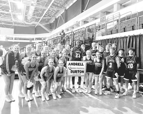 The Campus Colts celebrate Andrell Burton, Jr., reaching the 1,000-point mark of his high school basketball career at Dodge City. Contributed photo