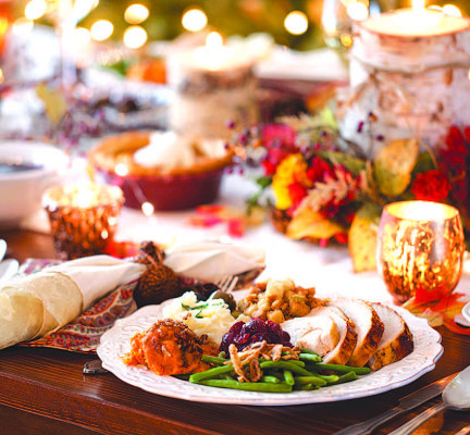 Holiday hosts can embrace various strategies to save money on family meals this season. Metro Creative