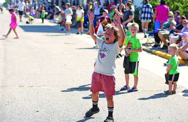 A young boy hollers to be sprayed with water during the Conway Springs Fall Fest parade on Saturday. The local fall festival season started last weekend in Conway Springs. Upcoming festivals will be held in Clearwater this weekend, in Goddard and Cheney the next weekend, and in Haysville in mid-October. Also this Saturday, Argonia will host its annual car show and street race. Stephanie McKennon/TSnews