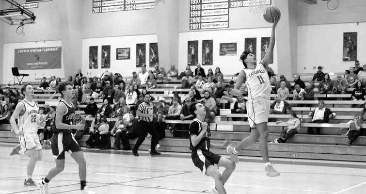 Hayden Frederick leads a fast break during last week’s home victory over Caldwell, one of two wins last week. Cardinal Times/Contributed photo