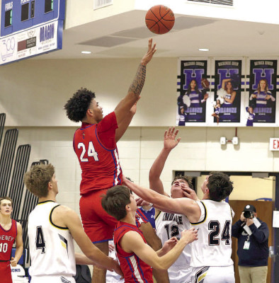 Quaid Thomas makes a basket amidst three Andale defeders during Cheney’s overtime win in the Adolph Rupp Tournament championship last Friday. Andrea McDaniel/TSnews