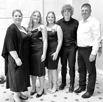 Sarah Schill, left, is pictured with family members. Next week will be her final time as the 4-H Fine Arts Superintendent at the Sedgwick County Fair. Contributed photo